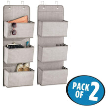 Load image into Gallery viewer, Storage organizer mdesign a568 soft fabric over the door hanging storage organizer with 3 large pockets for closets in bedrooms hallway entryway mudroom hooks included textured print 2 pack linen tan